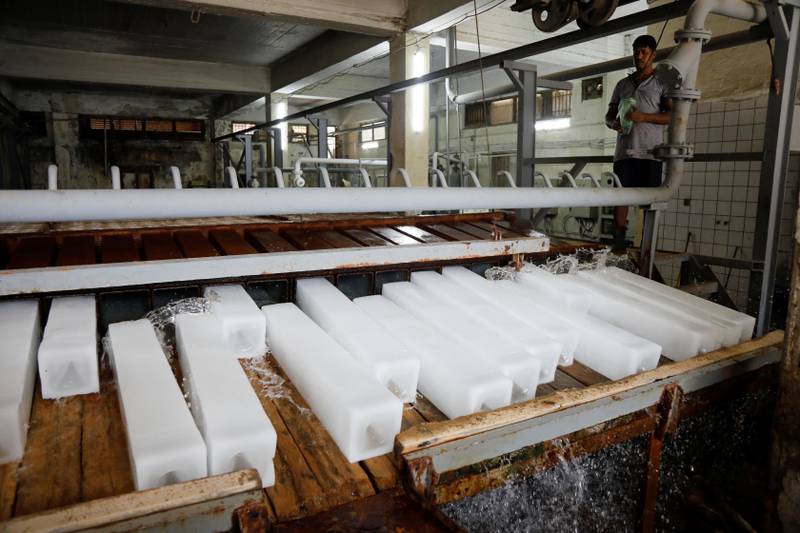 Ice blocks being prepared for sale as temperatures soar in Baghdad, Iraq.