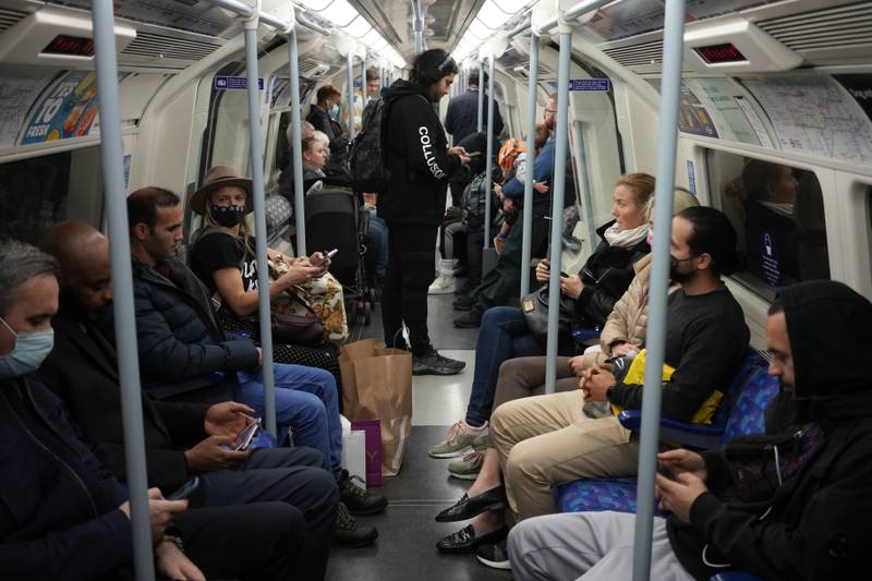 Passengers on a London Underground train on the Jubilee Line, where face coverings are required to be worn. AP Photo