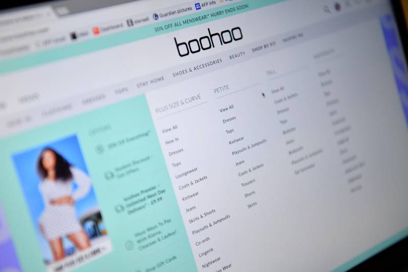 (FILES) In this file photo taken on April 30, 2020 the online fashion portal Boohoo is pictured on a laptop in London. Boohoo has announced it will launch an independent review of its UK supply chain on July 8, 2020. / AFP / Ben STANSALL
