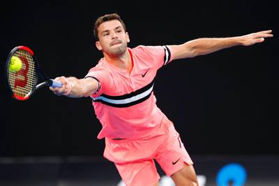 Grigor Dimitrov plays a forehand in his fourth round match against Nick Kyrgios. Darrian Traynor / Getty Images