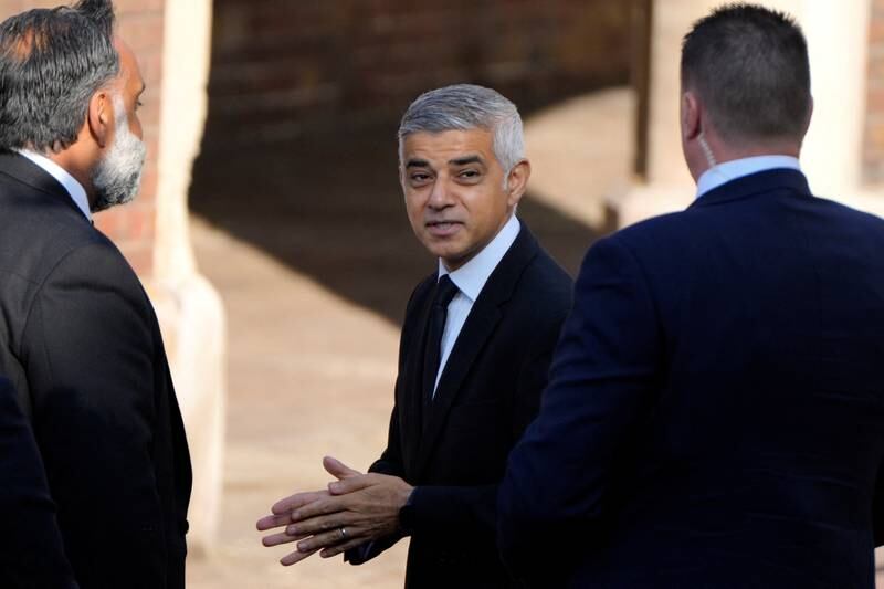London Mayor Sadiq Khan talks to security as he arrives at St James's Palace for the Accession Council ceremony. Reuters