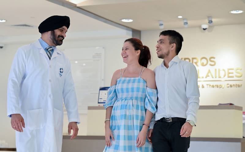 Dr Mandeep Singh with Colombian patient Liz Valentina Parra Rodriguez and her partner Jason Mateo Moreno Gutierrez. Photo: Burjeel Medical City 