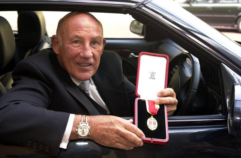 Sir Stirling Moss after he received his Knighthood from the Prince of Wales at an Investiture at Buckingham Palace in London in 2000. PA