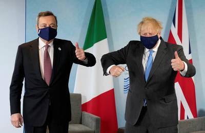 Boris Johnson and Italy's Prime Minister Mario Draghi elbow bump. Reuters