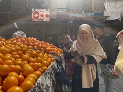 Noura Refaey, an Egyptian mother of three, at a food market in Cairo's Talbia where food prices continue to rise. Mahmoud Nasr / The National
