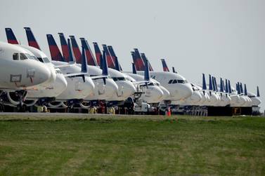 Dozens of mothballed Delta Air Lines jets are parked at Kansas City International Airport. The number of Americans getting on airplanes has sunk to a level not seen in more than 60 years as people shelter in their homes to avoid catching or spreading the new coronavirus. AP.