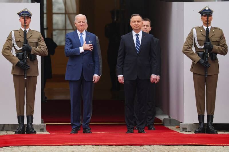 President Duda welcomes Mr Biden outside the Presidential Palace. Reuters