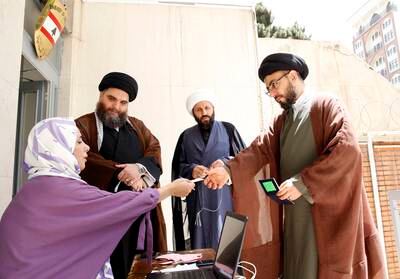 Lebanese clerics residing in Iran register to vote during the parliamentary elections at a polling station at the Lebanon embassy in Tehran, Iran. EPA