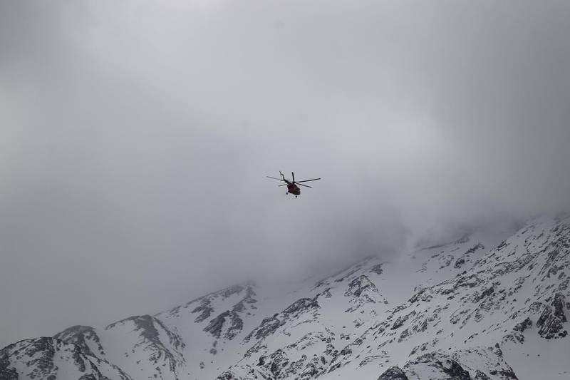 Emergency and rescue helicopter searches for the plane that crashed in a mountainous area of central Iran. Tasnim News Agency / Reuters