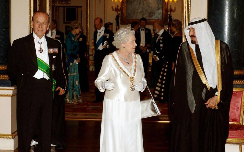 King Abdullah of Saudi Arabia (R) talks with Queen Elizabeth II (C) and The Duke of Edinburgh (L) before the State Banquet at Buckingham Palace in London after the first day of the Saudi Kings visit. The king received a lavish welcome from the queen today at the start of a state visit to Britain, though human rights protestors decried his presence.
 AFP PHOTO/John Stillwell-POOL / AFP PHOTO / POOL / JOHN STILLWELL