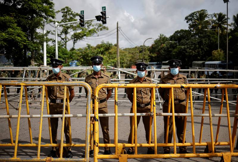 Police officers stand guard outside Parliament in Colombo. Reuters