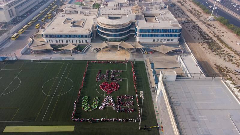 Hundreds of pupils stand together to write the message 'We love UAE' at Gems Wellington Academy in Al Khail on Flag Day. Photo: Gems Wellington Academy Al Khail