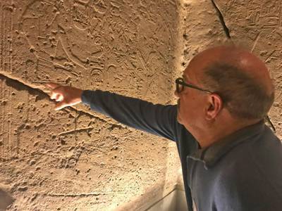 Luciano Paoli shows the inside of the Ellesiya Temple, one of the treasures transported away from an area of the Nile river valley flooded by the construction of the Aswan Dam, at the Egyptian museum in Turin, Italy.  AP Photo