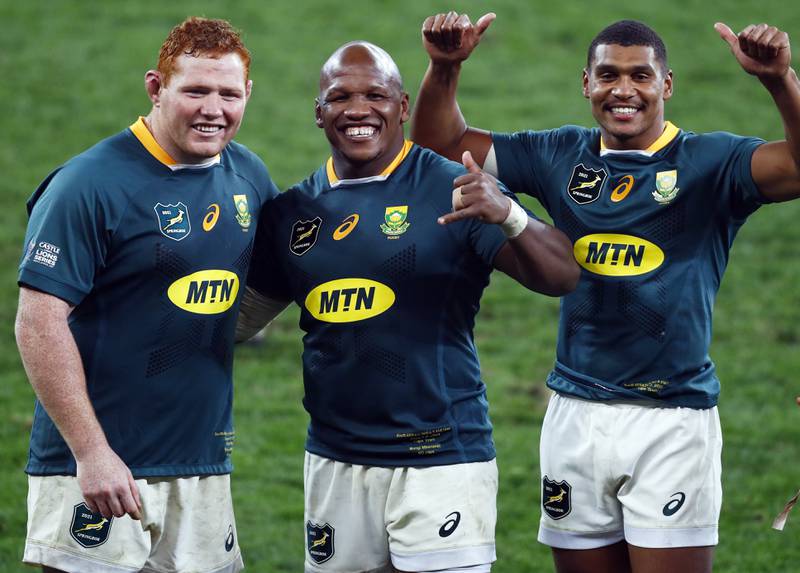 South Africa's Steven Kitshoff, Bongi Mbonambi and Damian Willemse celebrate after the final whistle of the third Test.