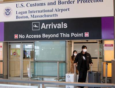 Passengers pass through the US Customs and Border Protection doorways on their arrival to Boston's Logan International Airport.  EPA