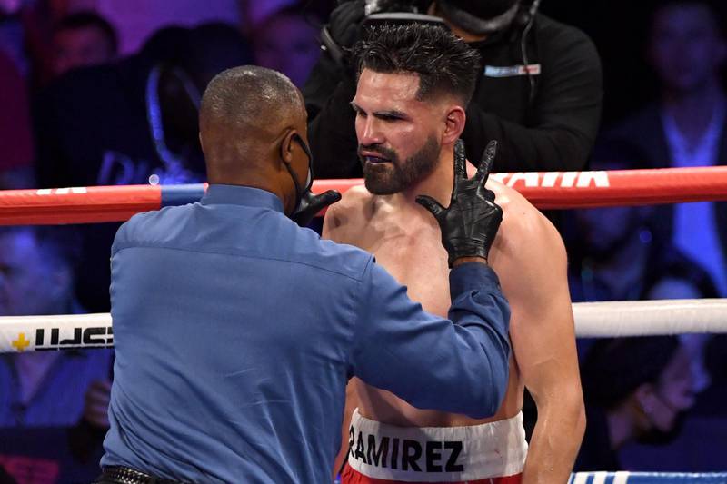 Referee Kenny Bayless counts to Jose Ramirez after the American was knocked down by Josh Taylor. AFP