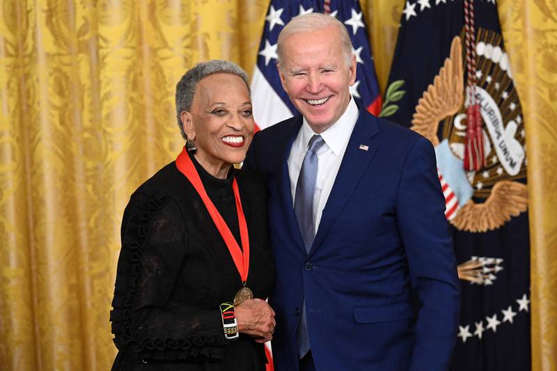 Mr Biden awards scholar Johnnetta Betsch Cole with the 2021 National Humanities Medal. AFP
