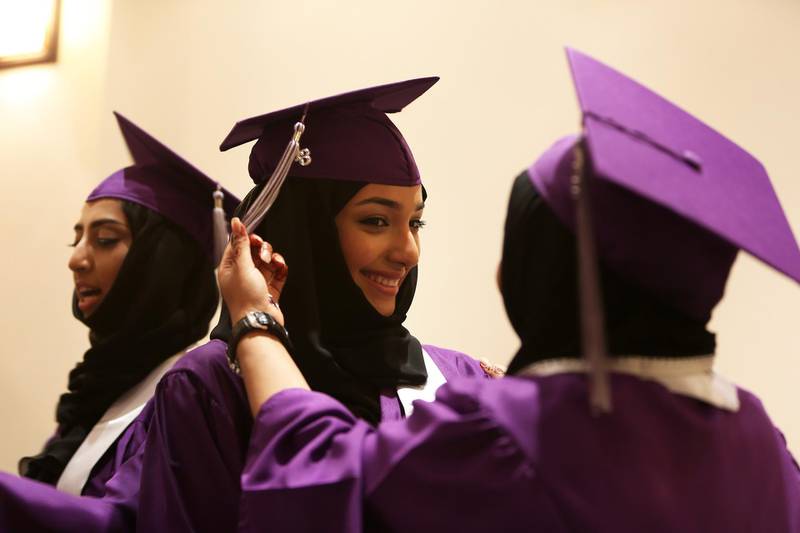 DUBAI , UNITED ARAB EMIRATES Ð June 24 , 2013 : Students getting ready before the Graduation Ceremony of Al - Mizhar American Academy at Dubai Cultural and Scientific Association in Al Mamzar in Dubai. ( Pawan Singh / The National ) For News. Story by Sachi *** Local Caption ***  PS2406- GRADUATION01.jpg