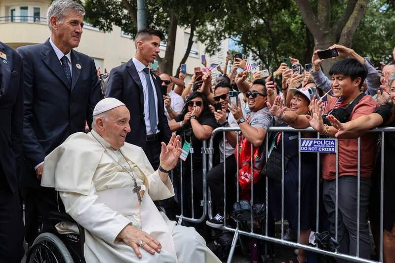 Pope Francis waves to the crowd on arrival for a meeting with Portugal's Prime Minister Antonio Costa.  Getty Images