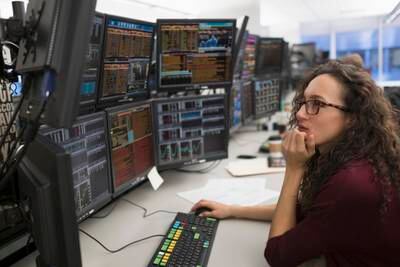 Young woman analyzing computer data. Getty Images