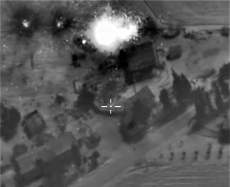 A video grab from October 1, 2015 shows an image taken from the Russian Defence Ministry's official website, purporting to show an air strike in Syria. President Vladimir Putin on October 1 dismissed claims that Russian air strikes had killed civilians in Syria as 'information warfare' but said Moscow would look into those reports. AFP
