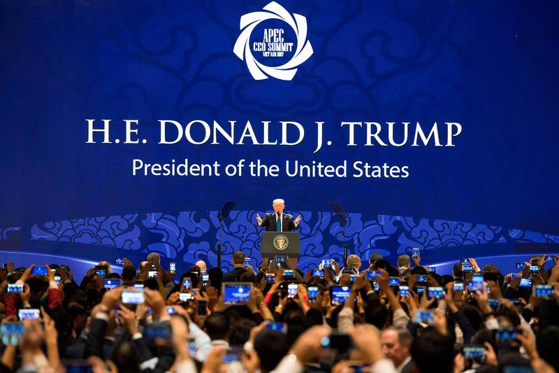 TOPSHOT - US President Donald Trump speaks on the final day of the APEC CEO Summit, part of the broader Asia-Pacific Economic Cooperation (APEC) leaders' summit, in the central Vietnamese city of Danang on November 10, 2017.
World leaders and senior business figures are gathering in the Vietnamese city of Danang this week for the annual 21-member APEC summit.
 / AFP PHOTO / JIM WATSON