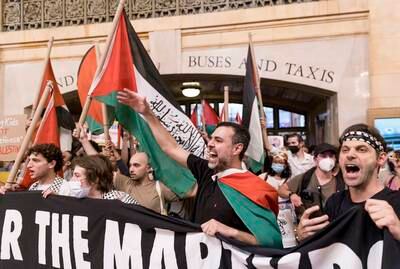 People march during a rally in support of Gaza Strip residents at the Grand Central Terminal in New York. EPA