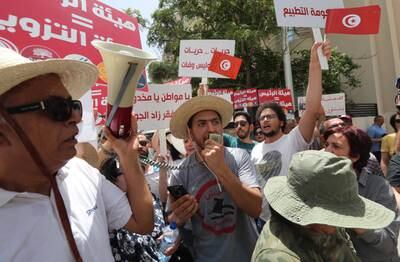 Tunisians shout slogans against President Kais Saied  in Tunis. EPA