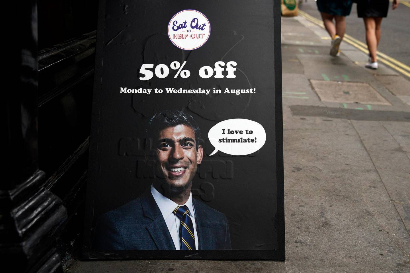 epa08601388 A sign advertising 'Eat Out to Help Out' scheme by Chancellor of the Exchequer Rishi Sunak near Oxford Street, Central London, Britain, 13 August 2020. According to news reports, the UK is now officially in recession. Britain is set to experience its worst recession on record after data showed the Coronavirus sent the UK economy plunging by over twenty percent for the second quarter of 2020.  EPA/WILL OLIVER