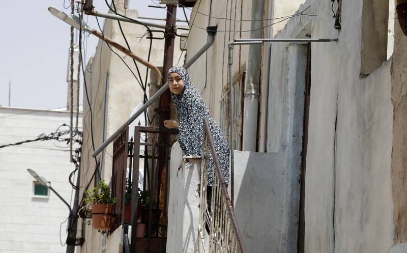 A school girl living in the Al Wehdat Palestinian Refugee camp, run by the the United Nations Relief and Works Agency for Palestine Refugees in the Near East, southeast Amman, Jordan, 22 April. Amel Pain / EPA