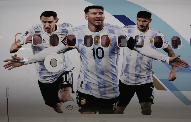 The airplane carrying the Argentina nsquad is painted with pictures of Lionel Messi, center, Angel Di Maria, left, and Rodrigo De Paul arrives at Hamad International airport in Doha, Qatar. AP Photo 