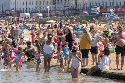 Families paddle in the tidal pool in Margate. The start of meteorological summer was met with high temperatures across England. Getty Images