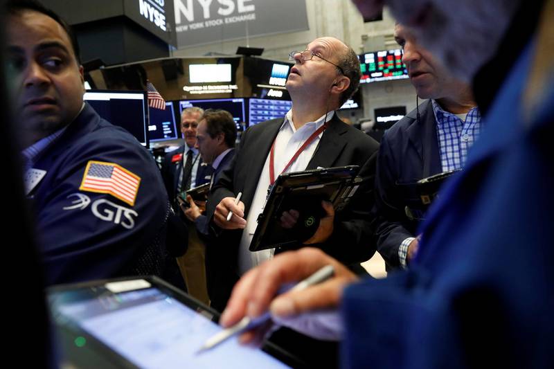 Traders work on the floor of the New York Stock Exchange shortly after the opening bell in New York, U.S., July 27, 2018.  REUTERS/Lucas Jackson