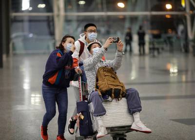 Passengers wear masks at Guangzhou airport in Guangzhou, Guangdong Province, China. EPA