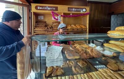 A customer shops at a bakery in Tunis.  Reuters