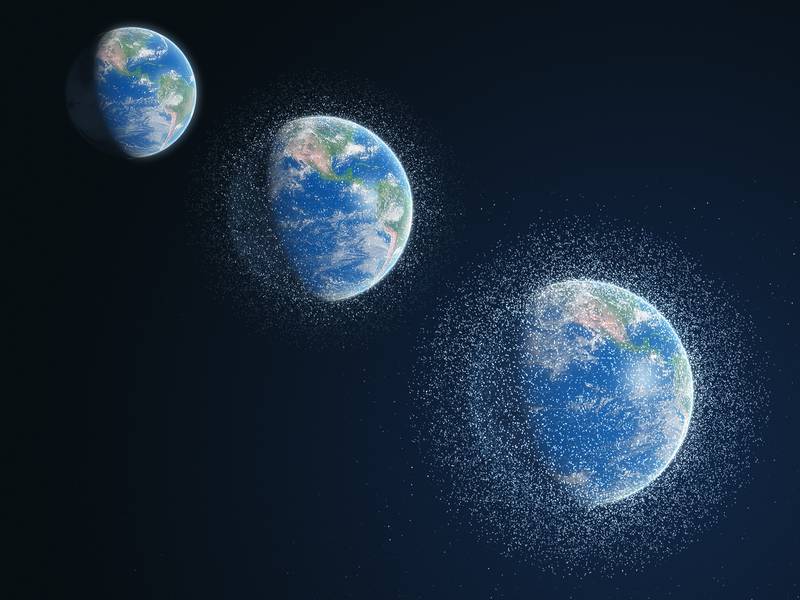 An illustration showing the growing problem of space junk, from the 1950s, top left, to the present day, bottom right. AP