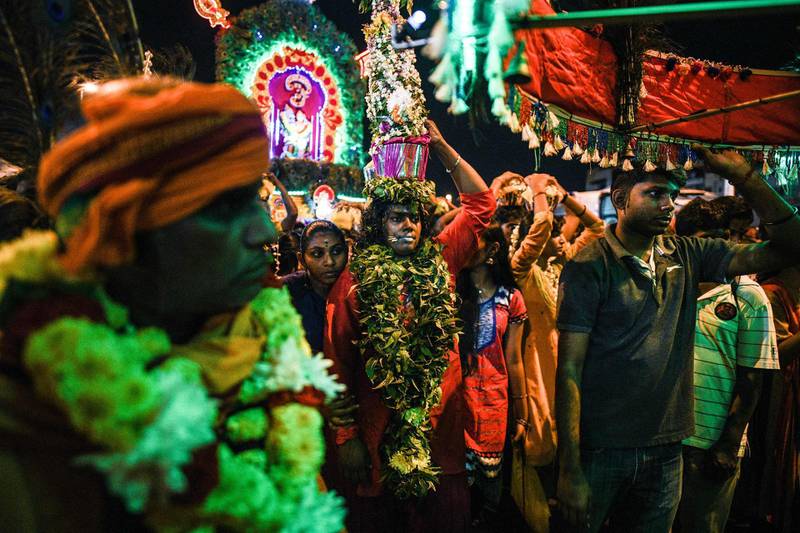 On February 7, Hindu devotees carrying milk pots on their heads as offerings as they make their way toward the Batu Caves temple during the Thaipusam festival in Batu Caves on the outskirts of Kuala Lumpur. The Hindu festival of Thaipusam, which commemorates the day when Goddess Pavarthi gave her son Lord Muruga an invincible lance with which he destroyed evil demons, is celebrated by some two million ethnic Indians in Malaysia and Singapore. AFP