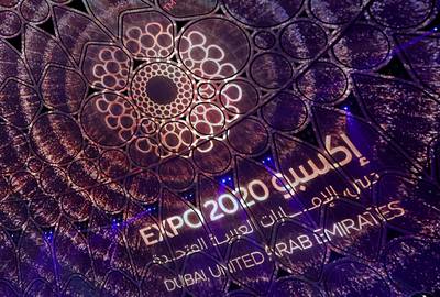 A logo of the Dubai Expo 2020 is projected during the opening ceremony, on September 30, 2021. AFP
