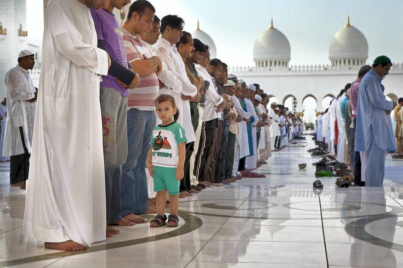 ABU DHABI, UNITED ARAB EMIRATES,  August 19, 2012. Worshippers gather and pray at the Grand Mosque in Abu Dhabi for the Eid morning prayers that follows on the first morning of the end of the holy month of Ramadan. (ANTONIE ROBERTSON / The National)