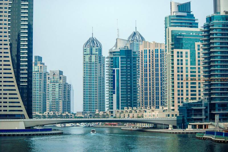 Futuristic architecture of skyscrapers in Persian Gulf. Dubai marina cityscape panorama. Luxury buildings in modern emirates.