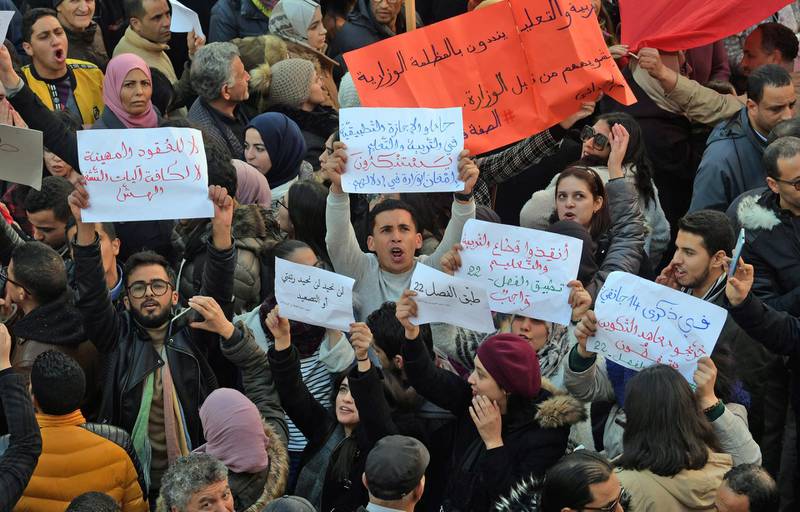 Tunisians take part in a rally marking the ninth anniversary of the 2011 uprising, at Habib Bourguiba Avenue in Tunis on January 14, 2020. (Photo by FETHI BELAID / AFP)