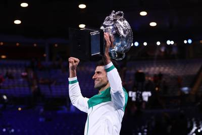 Novak Djokovic celebrates after winning his ninth title at Melbourne Park. Getty