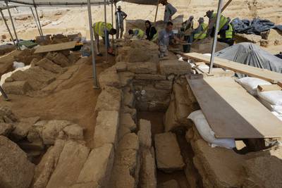 Palestinian archaeologists remove sand from graves at the Roman cemetery in Jebaliya northern Gaza Strip, Saturday, Sept.  23, 2023.  The ancient cemetery was uncovered last year during construction of a housing project.  Researchers have uncovered 135 graves, including two sarcophagi made of lead.  (AP Photo / Adel Hana)