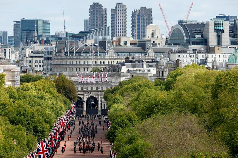 The London skyline is seen as the procession moves down The Mall. Getty Images