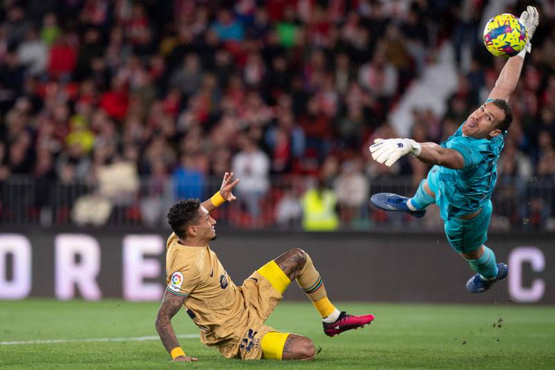 Barcelona's Raphinha challenges Almeria goalkeeper Fernando Martinez. AFP