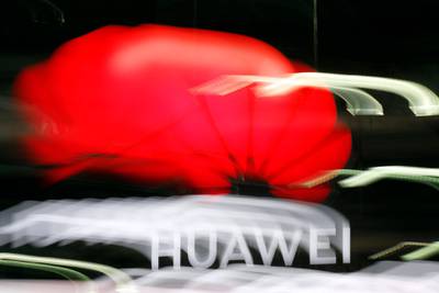 An illuminated Huawei sign is on display during the 10th Global mobile broadband forum hosted by Huawei in Zurich on October 15, 2019. - Chinese telecom giant Huawei announced on October 16, 2019 that it has passed the 400,000 5G antennas mark, the fifth generation of mobile phones, in the world with 56 operators who have already started to roll out the new mobile network. (Photo by STEFAN WERMUTH / AFP) / AFP / STEFAN WERMUTH
