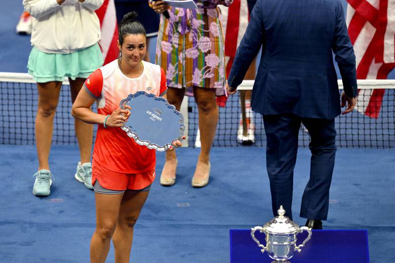 Ons Jabeur poses with the runners-up plate after being defeated by Iga Swiatek in the 2022 US Open final. AFP