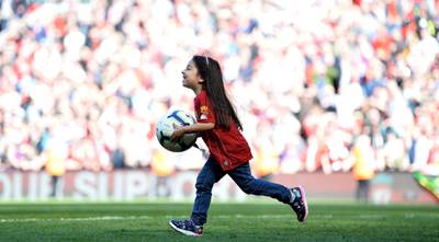 Mohamed Salah's daughter Makka plays with the ball.  EPA