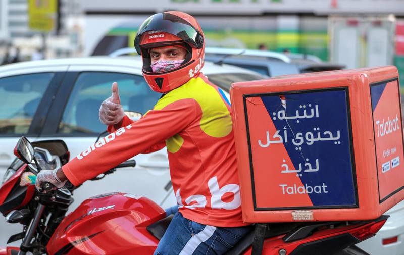 Abu Dhabi, United Arab Emirates, October 5, 2020.  A Talabat driver is all thumbs up at central Abu Dhabi.Victor Besa/The NationalSection:  NAFor:  Covid-19/standalone