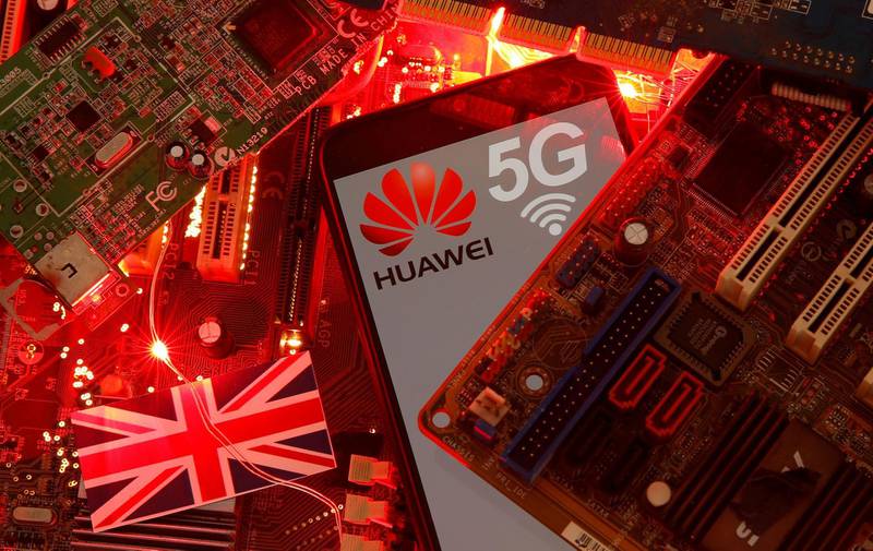 FILE PHOTO: The British flag and a smartphone with a Huawei and 5G network logo are seen on a PC motherboard in this illustration picture taken January 29, 2020. REUTERS/Dado Ruvic/File Photo